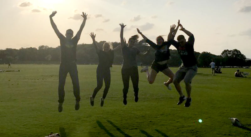 Employees Jumping in the Air