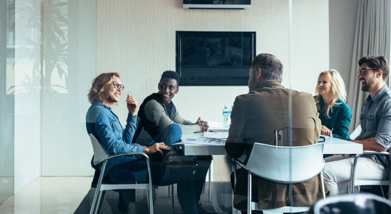 People laughing in a meeting