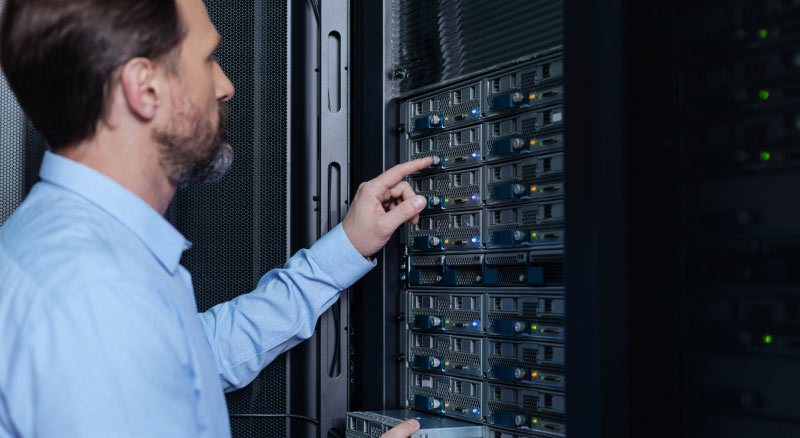Man looking at servers