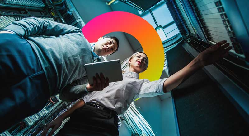 Two people working in data center