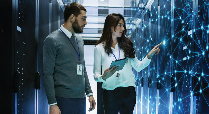 Man and woman in data center