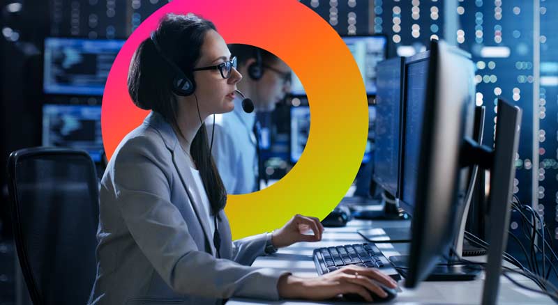 Woman in server room working on computer