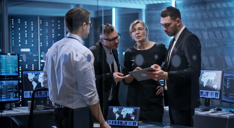 Group of professionals standing together in a meeting