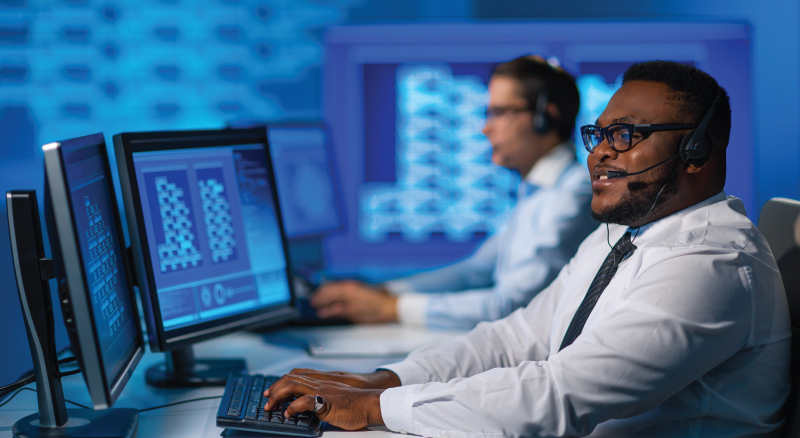 Man working in data center with headset on