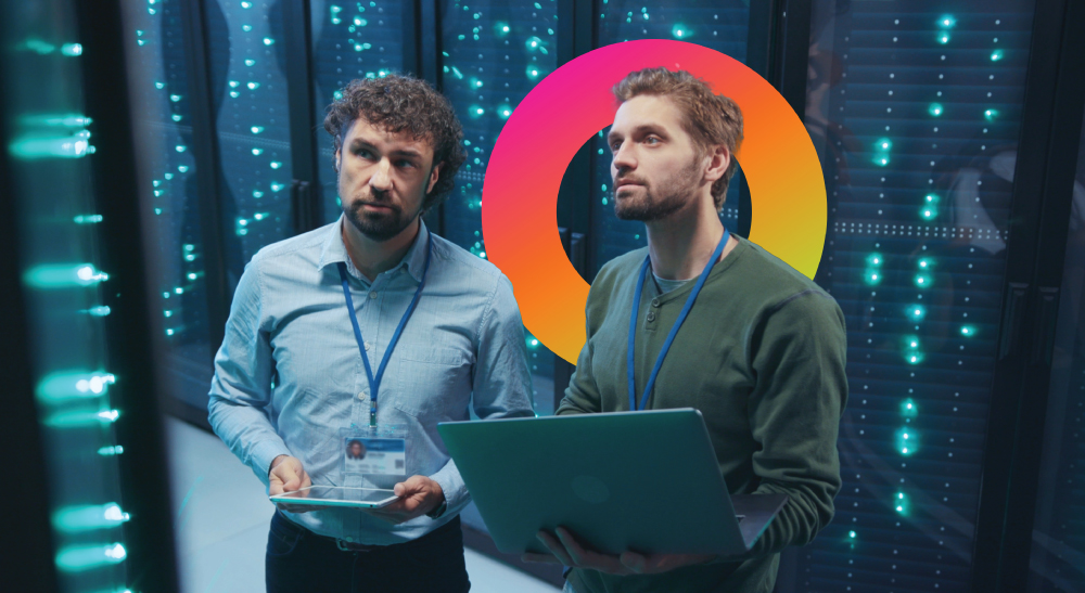 Two men working in a server room