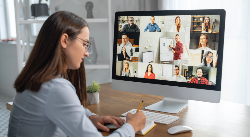 Woman at home on a remote call with coworkers