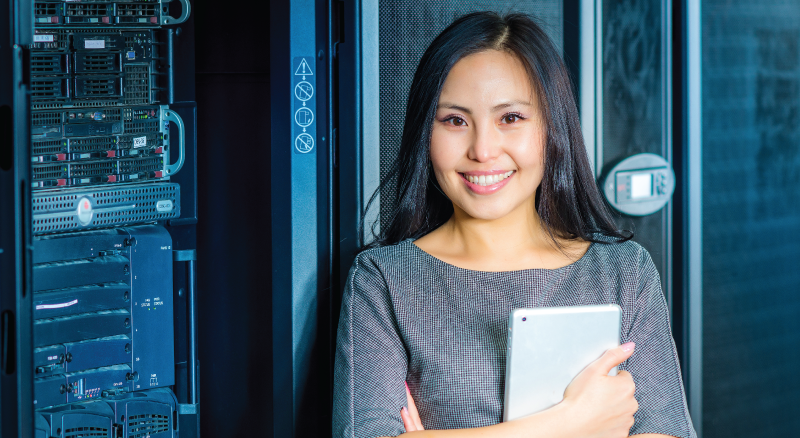 Woman in data center with ipad