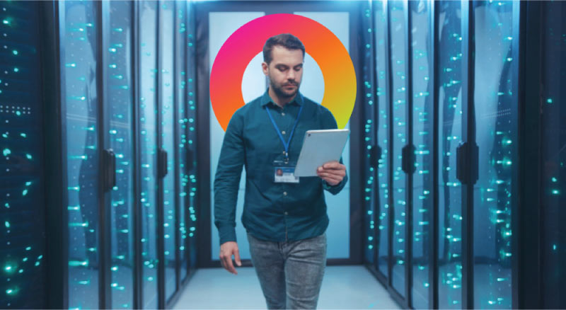 Man walking while holding tablet in data center