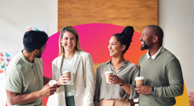A group of people holding cups of coffee