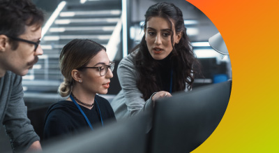 Employees working on computers in office