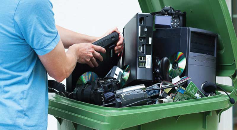 green garbage recycling bin full of electronics asset disposal thumbanil