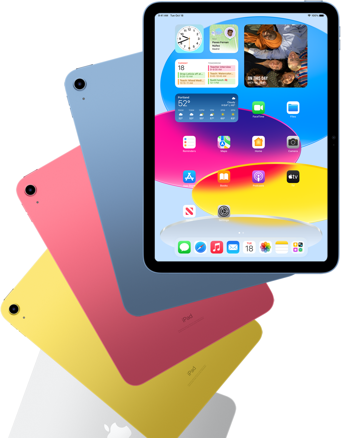 Front view iPad shows home screen with blue, pink, yellow, and silver rear facing iPads behind it.