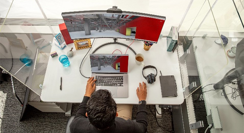 A top view of someone working at their desk