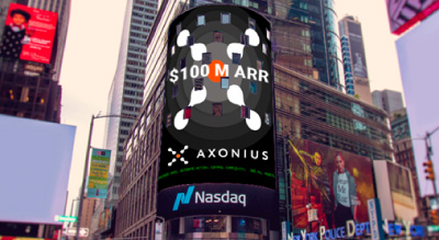 A vibrant digital billboard in Times Square celebrates Axonius reaching $100M ARR