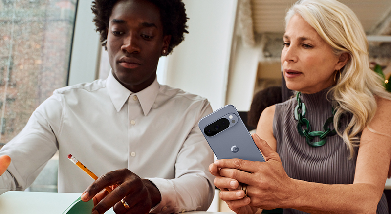 An individual displaying their smartphone screen to another person