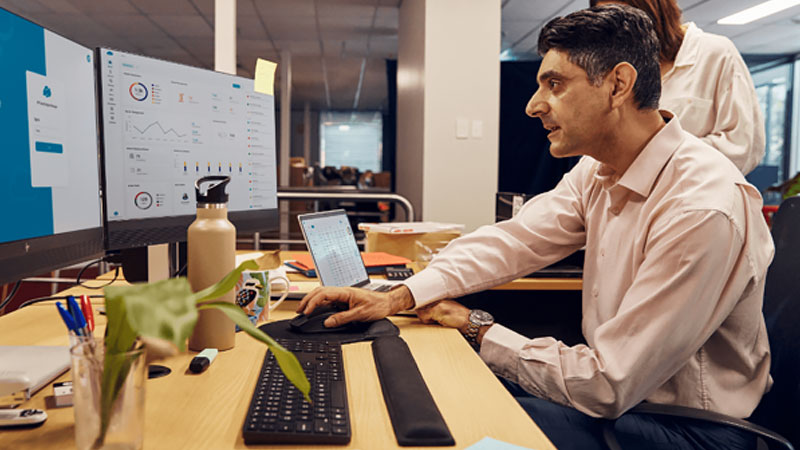 Man reviews dashboard overview on computer