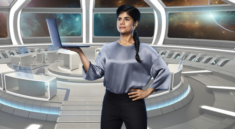 Woman on space craft holding laptop