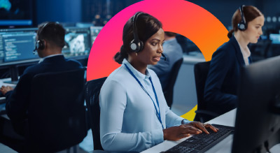 Woman in headset working on computer