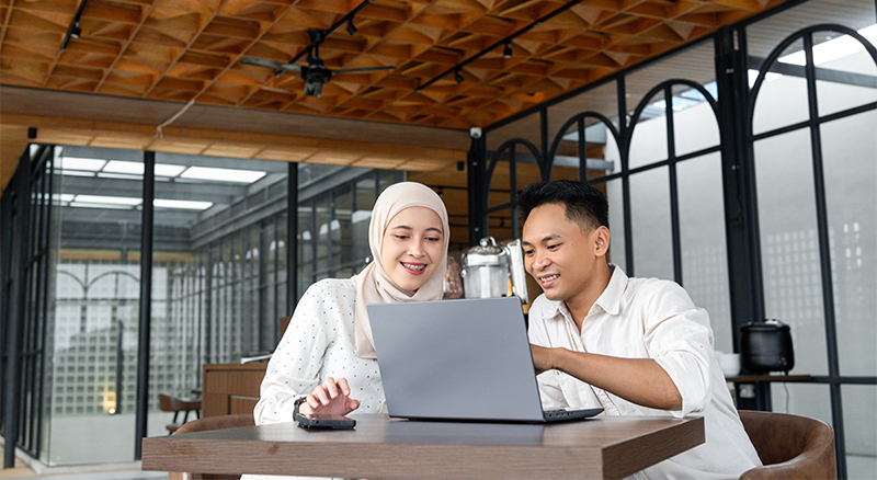 Two people collaborating in an office setting