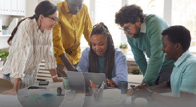 Diverse group of employees on a laptop