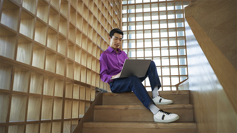 Employee working on laptop with snapdragon x elite