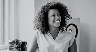 Woman smiles looking off camera