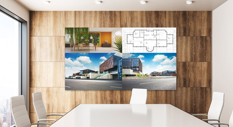 A collage of images on a digital monitor display featuring an interior design, a building floor plan, and an exterior view of a modern building, viewed from a conference room