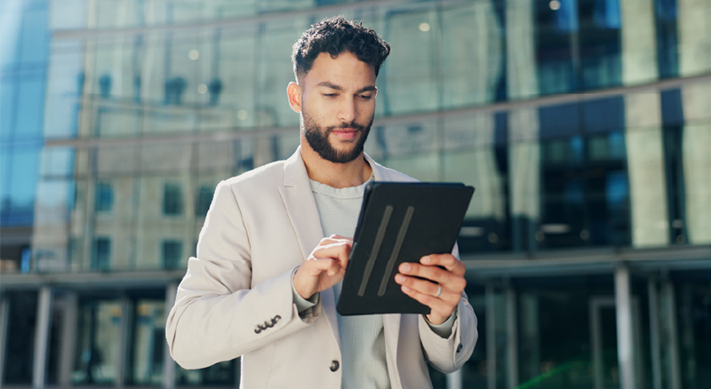 Person using a tablet in an outdoor setting