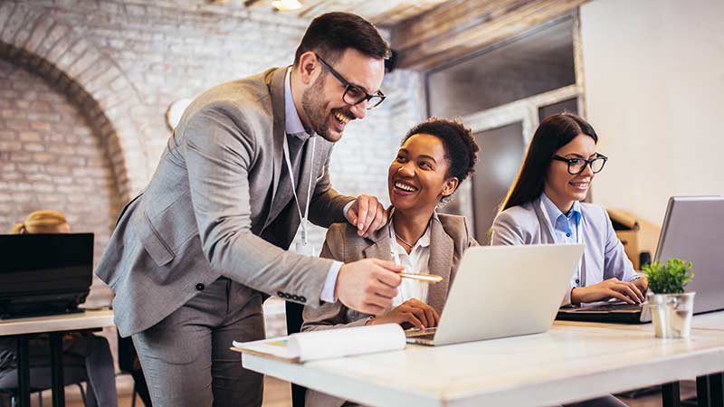 Group of colleagues working at a desk shi buyers guide callout thumbnail