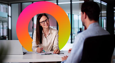 Two individuals talking in an office setting