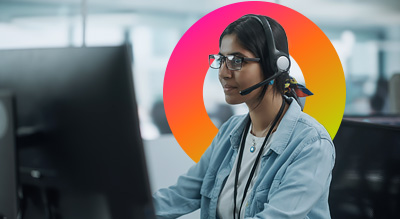 Worker in headset looking at laptop
