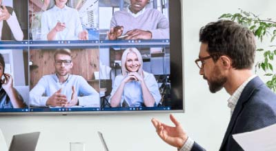 Man in meeting zooming with coworkers