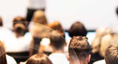 An audience watching a presentation