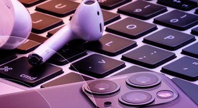 Airpods laying on a laptop keyboard