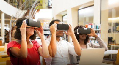 Three people using vr headsets in library