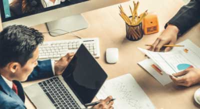 Man uses laptop during online meeting