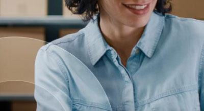 An individual works on a desktop computer