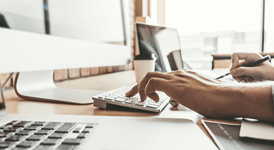 Hands using computer keyboard