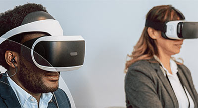 Man and woman wearing VR headset