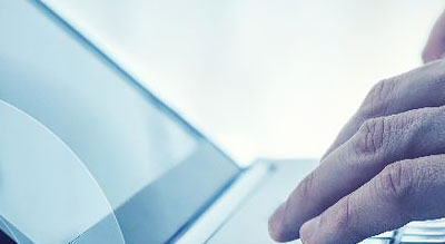 Close up of hands typing on laptop