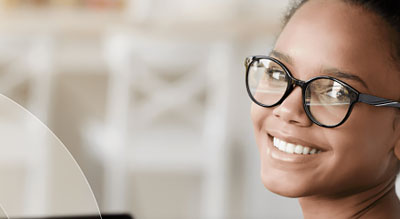 Child with glasses smiles