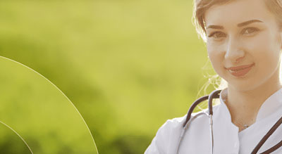 medical professional smiles in field