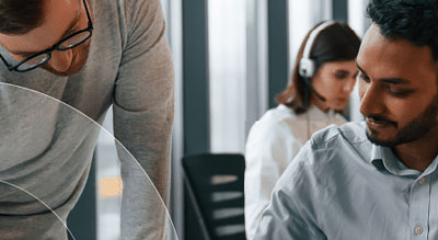 Two people working together in an office setting