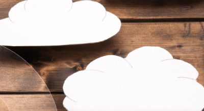 Paper clouds on a wooden table