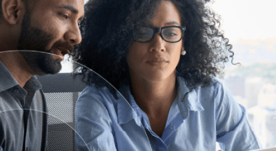 Two people sitting in an office setting