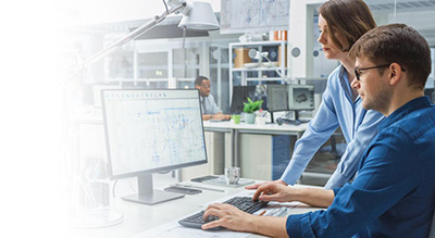 Man and woman working on a computer