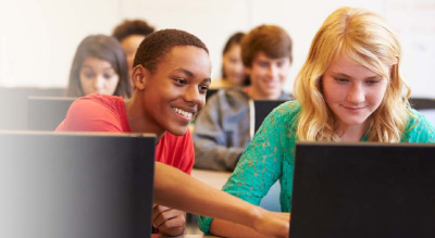 students working together on laptop