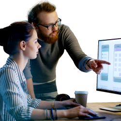 Two workers looking at a computer screen