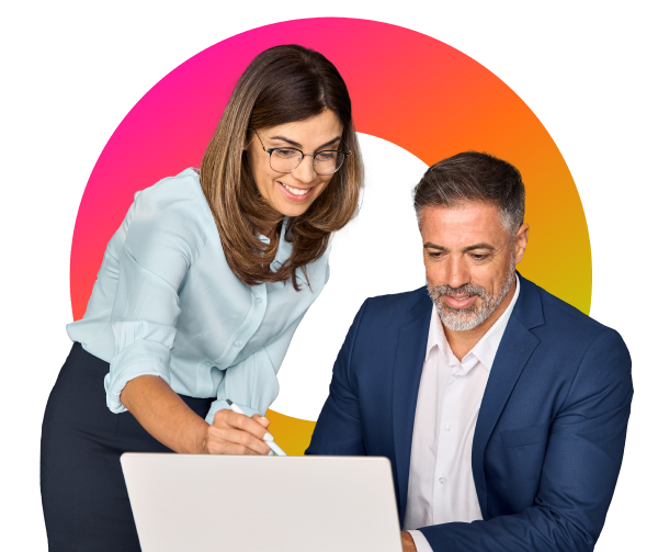 Two individuals looking at a laptop