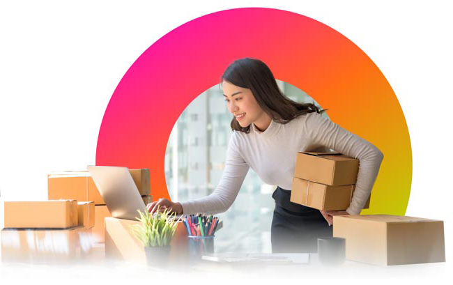 woman with boxes at laptop